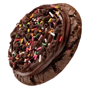 A chocolate cookie adorned with vibrant sprinkles, highlighting its cake batter flavor and soft texture.