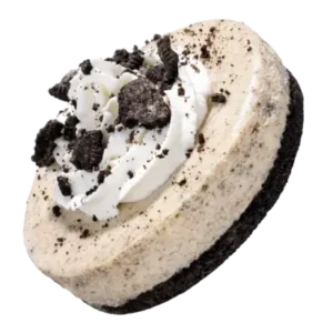 A creamy cheesecake topped with crushed cookies, showcasing a delicious cookies and cream flavor.